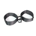 Black knitted adult toy accessory strap for harness use.