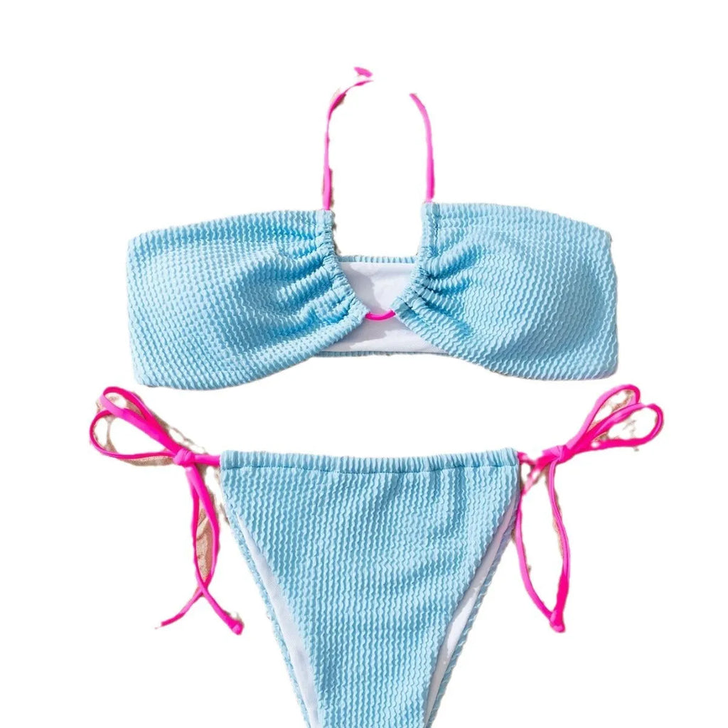 Solid colour women's two-piece swimsuit with halter lace-up top and briefs on a model