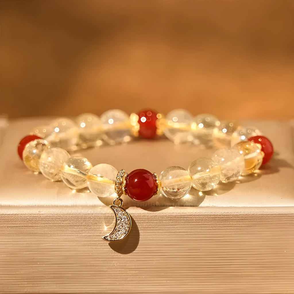 Women's handmade crystal bracelet featuring citrine and red agate beads in a moon boom style.
