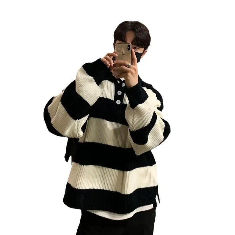 Man modelling a loose-fit black and grey striped polyester sweater coat, a long-sleeve pullover.