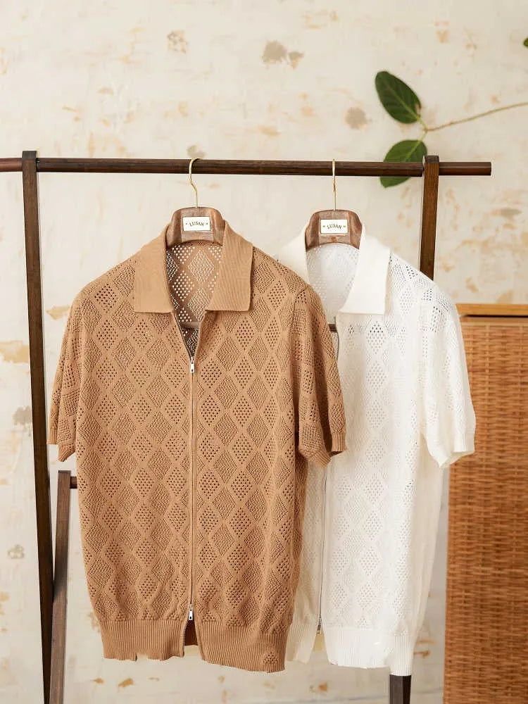 Man wearing a light brown, short sleeve cotton cardigan with a front zipper and lapel collar.