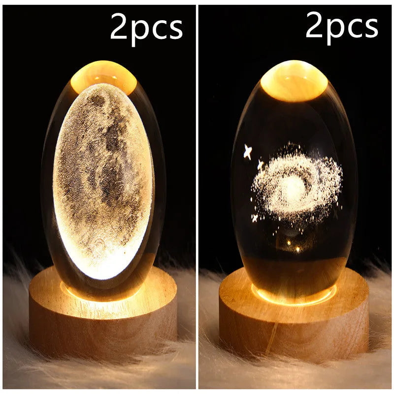 LED galaxy crystal ball night light with 3D planet designs on a table