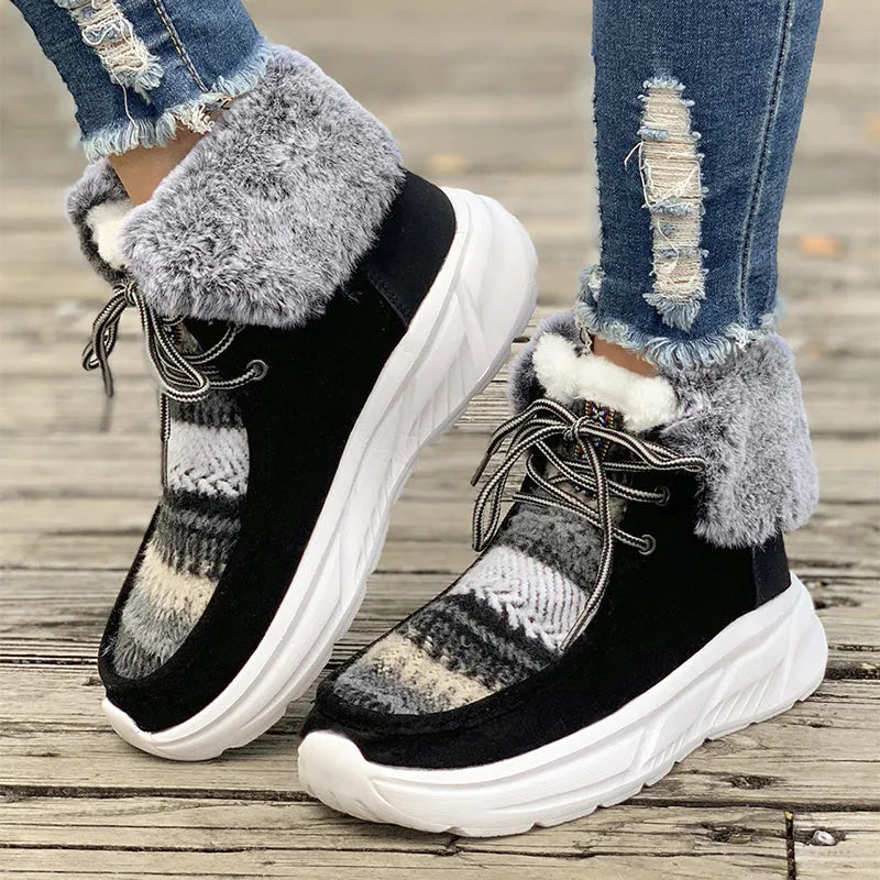 Women's beige suede lace-up snow boots with a thick platform sole and plush lining on a white background.