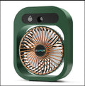 Green and white USB portable misting fan air cooler humidifier on a desk
