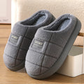 Men's brown and grey plaid cotton slippers with wool lining and a thick EVA sole.