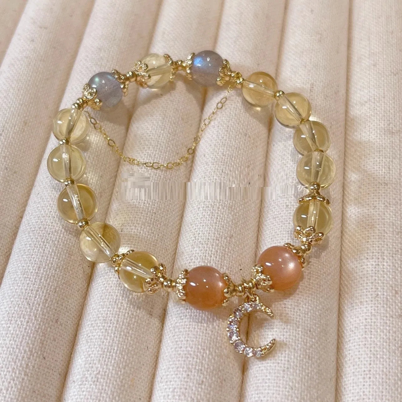 Chinese style women's crystal bracelet with 14K gold electroplating, moonstone, and golden sun stone fortune crystal design
