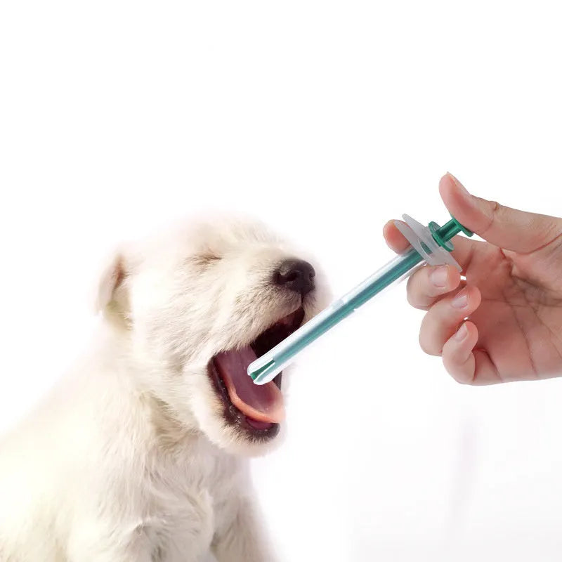 Two silicone pet pill shooters with soft tips for feeding medication to cats and dogs.
