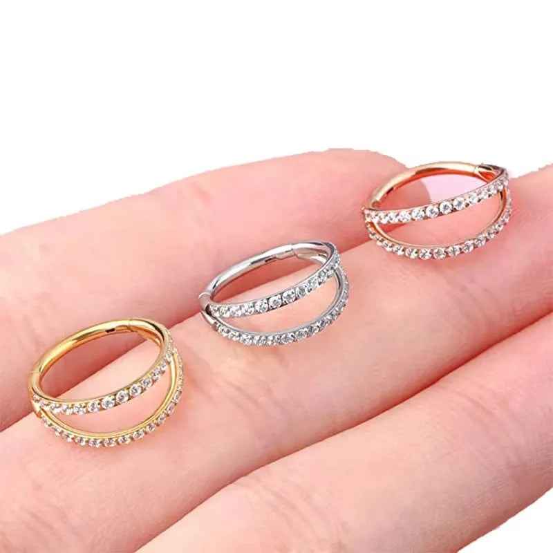 G23 titanium alloy nose ring with monoclinic diamond coating in steel or gold colour, showing size options.