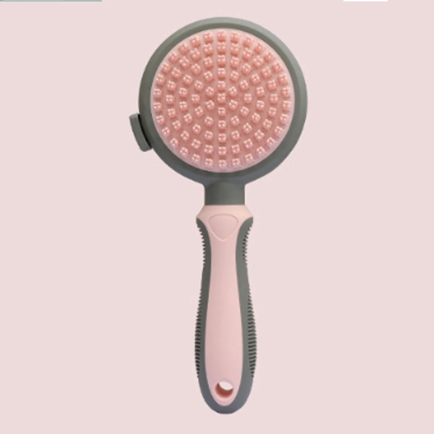 Double-sided pink cat grooming brush with release button and flea comb component