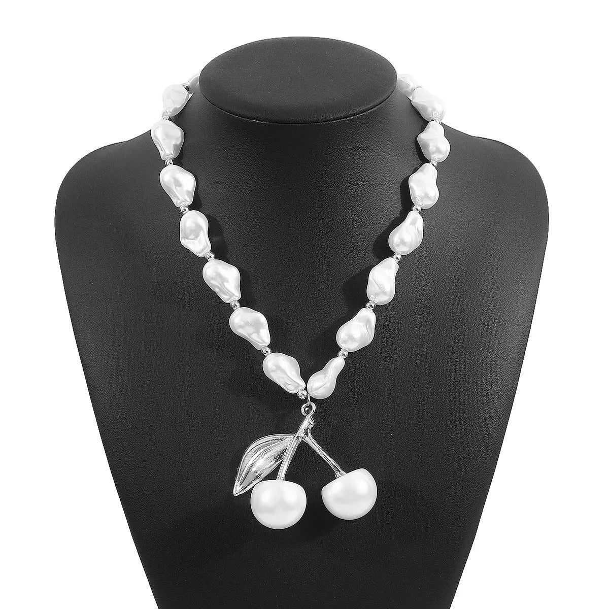 Women's creative necklace with gold alloy cherry fruit pendant on a white imitation pearl chain.