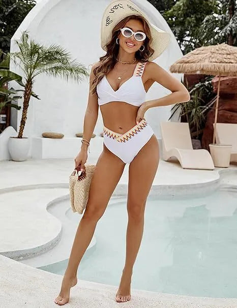 Black and white women's lace-up bikini with high-waisted briefs on a mannequin.