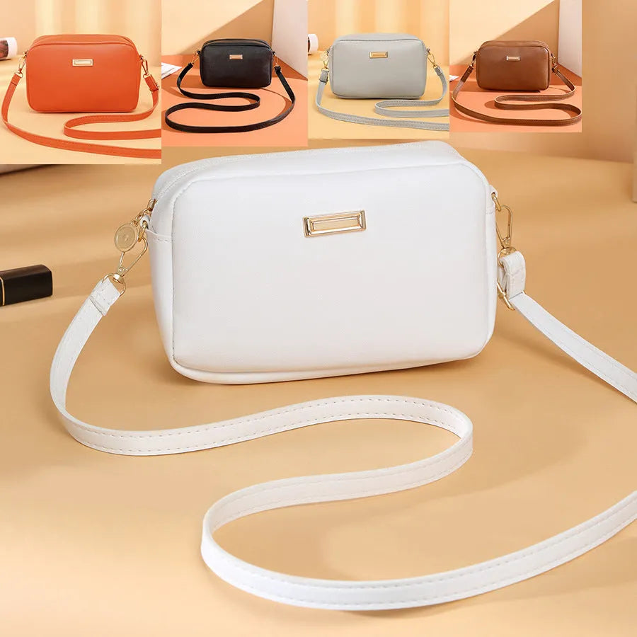 Women's solid colour PU shoulder bag with a horizontal square shape and a front pocket.
