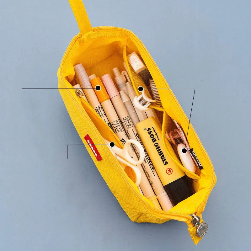 Large canvas pencil case with double zipper in yellow, black, and dark blue colour options