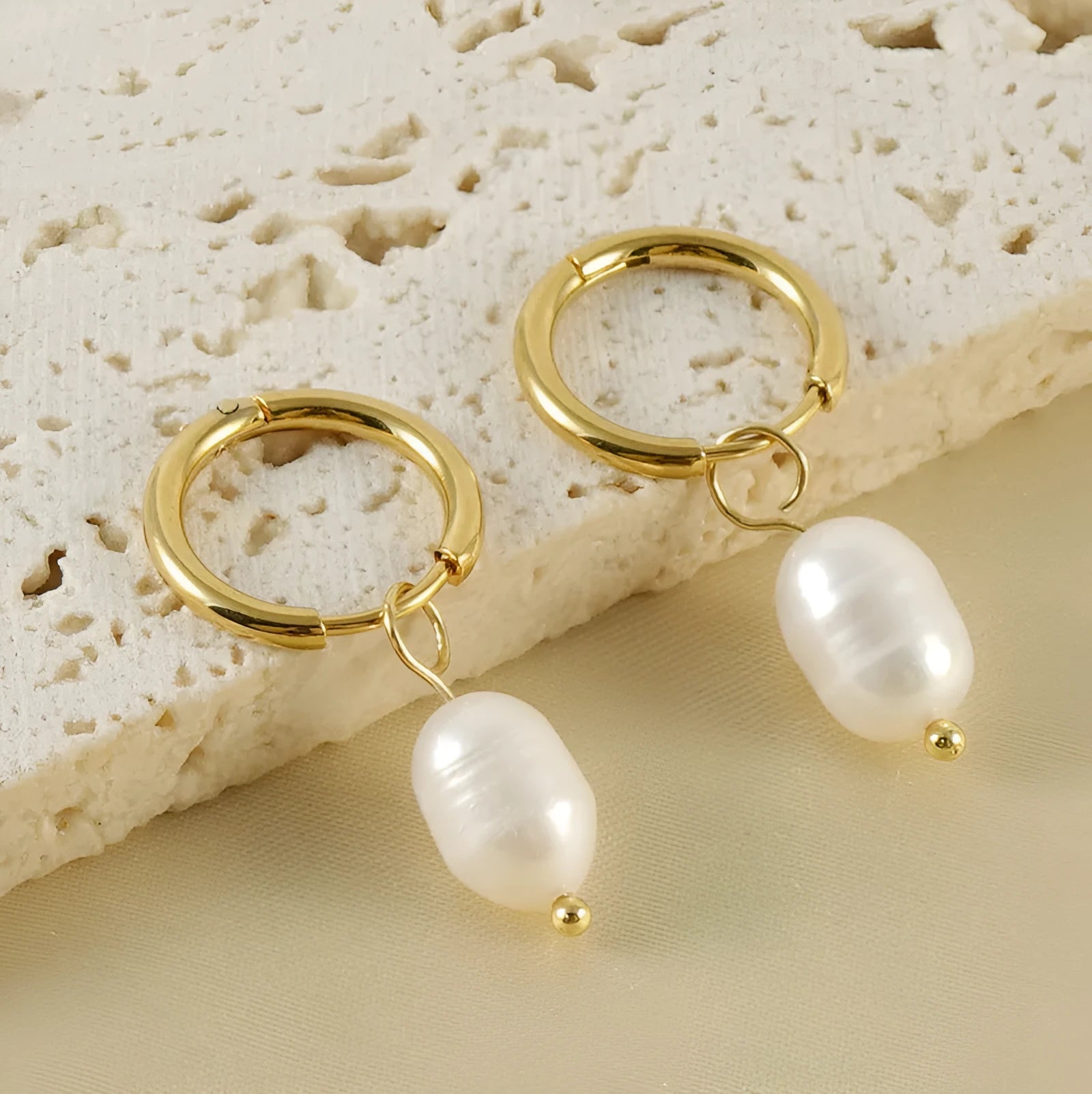 Gold geometric pearl earrings for women made from stainless steel and titanium steel wire.