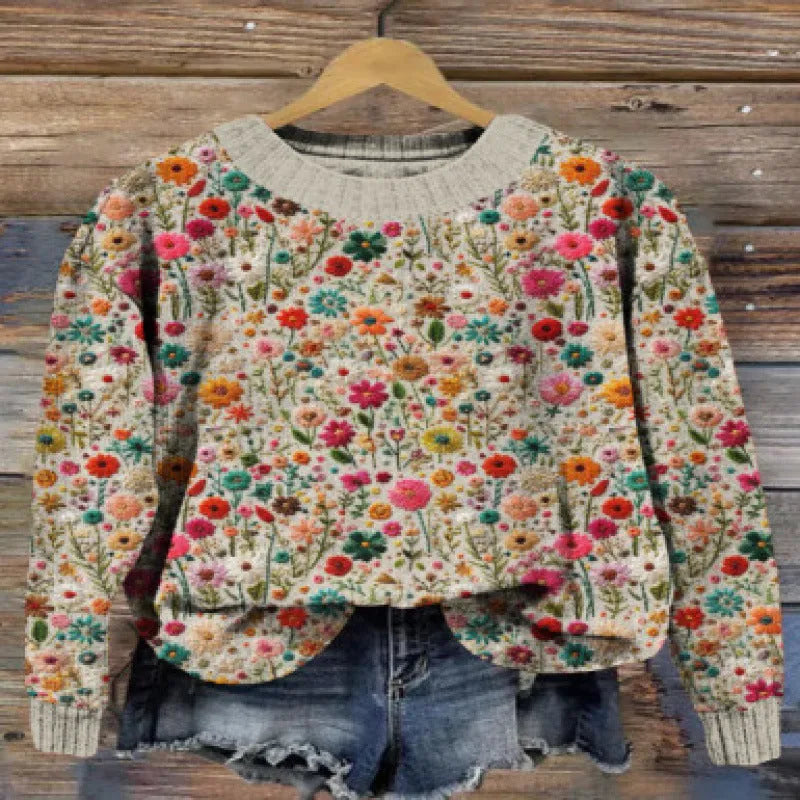 Little Flower digital printed round neck long sleeve sweater on a hanger.