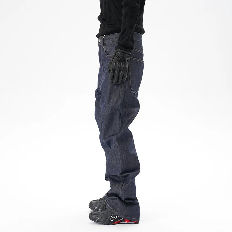 A pair of dark blue loose straight-cut jeans laid flat, showing the front design.