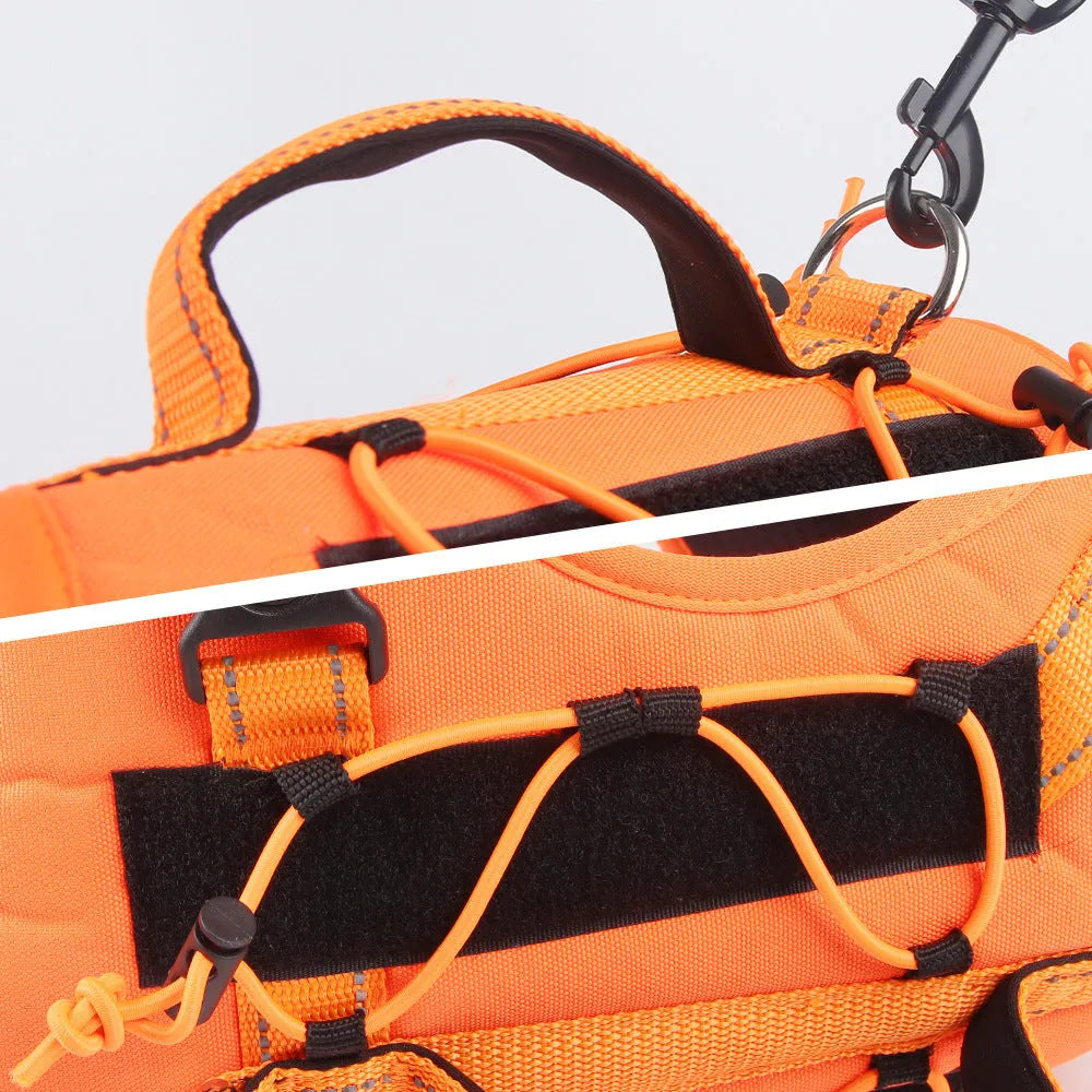 Orange reflective dog harness with an attached black hand-holding rope, shown on a medium-sized dog.
