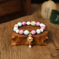 Grey porcelain glazed ceramic lucky rabbit charm bracelet on black elasticated cord