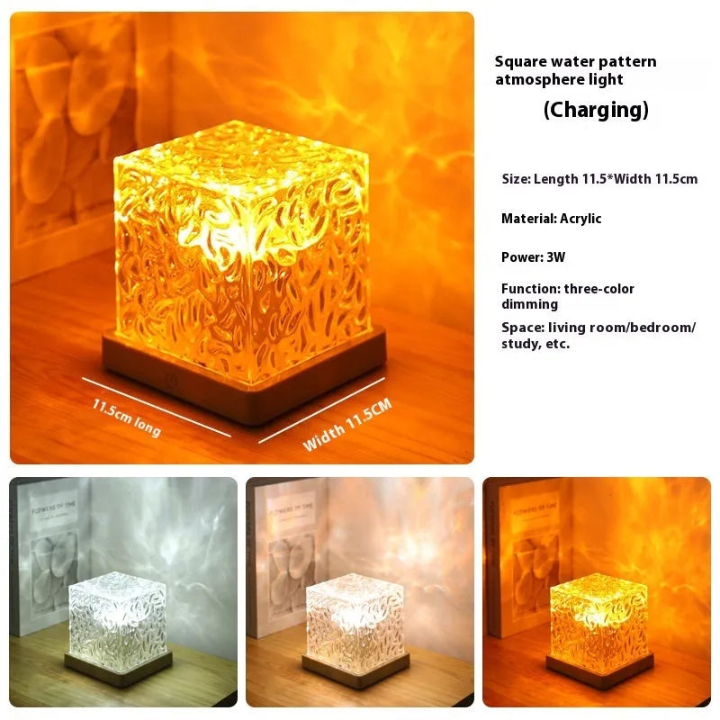 LED water ripple night light with rotating crystal projection and remote control on wooden surface