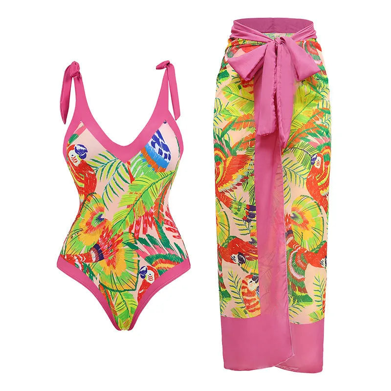 Retro pink floral print one-piece swimsuit with V-neck, skirt, and backless design.
