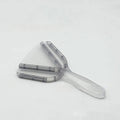 Adjustable telescopic bottle and can opener with a non-slip red handle on a kitchen counter.