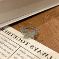 Copper butterfly women's ring with dripping oil texture and an open loop design.