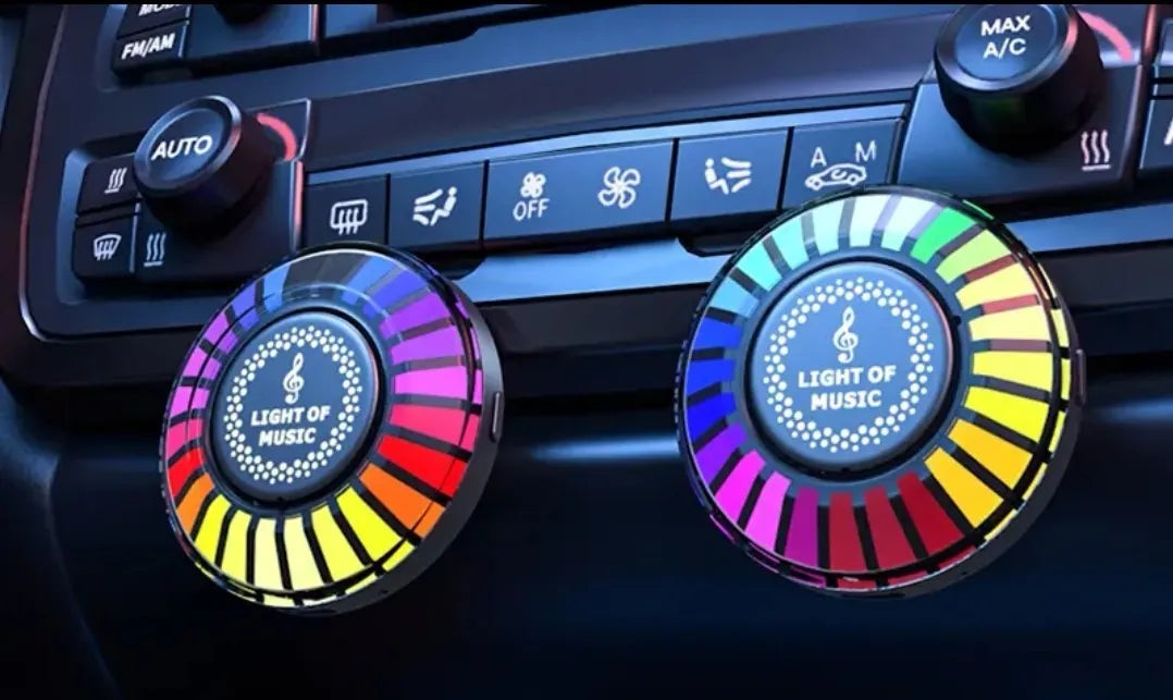 Car air vent aromatherapy unit with colourful RGB lights and choice of scent styles.