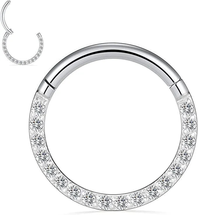 Stainless steel seamless nose ring with a small diamond on the front, shown in a gold finish.