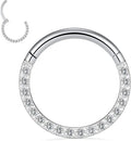 Stainless steel seamless nose ring with a small diamond on the front, shown in a gold finish.