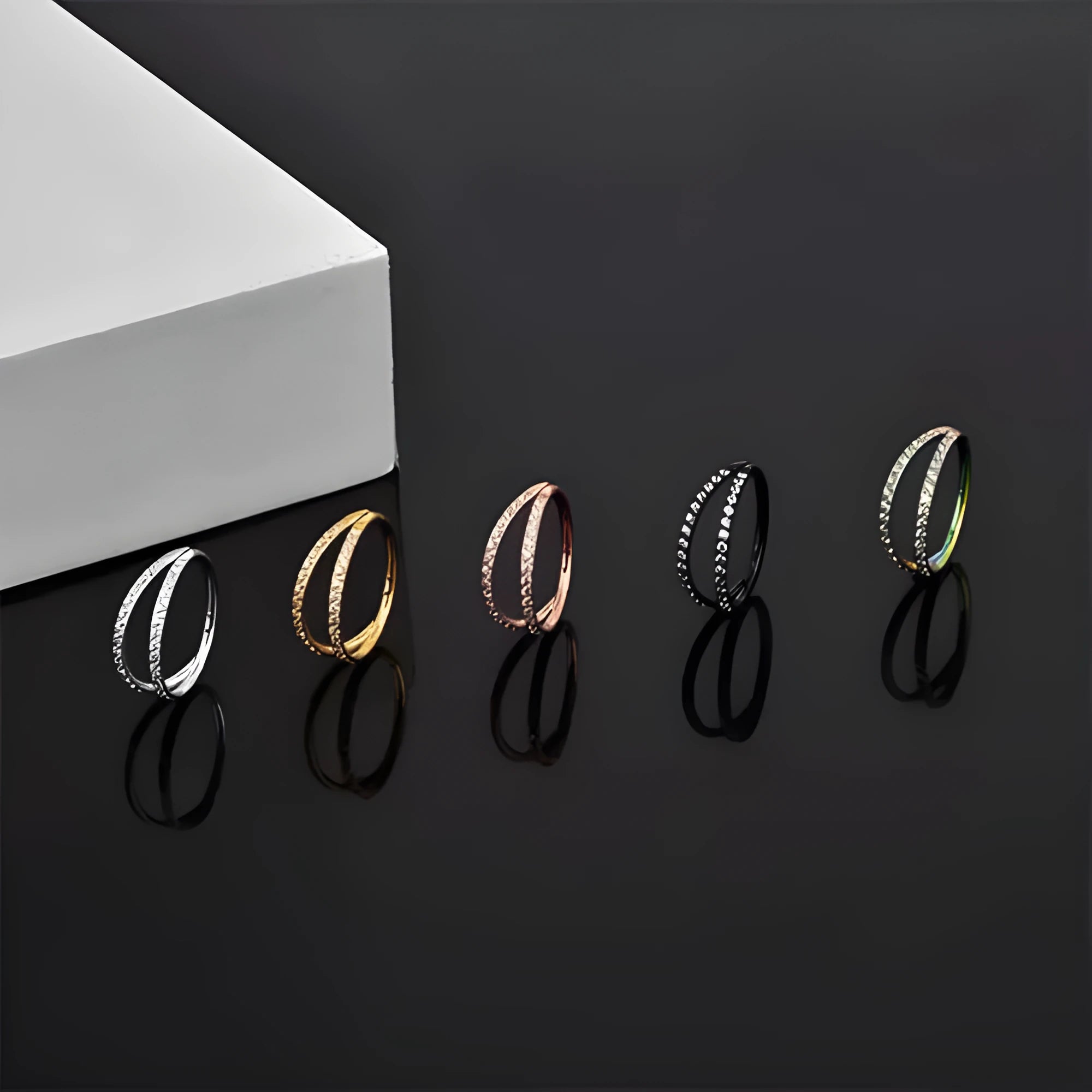 G23 titanium alloy nose ring with monoclinic diamond coating in steel or gold colour, showing size options.