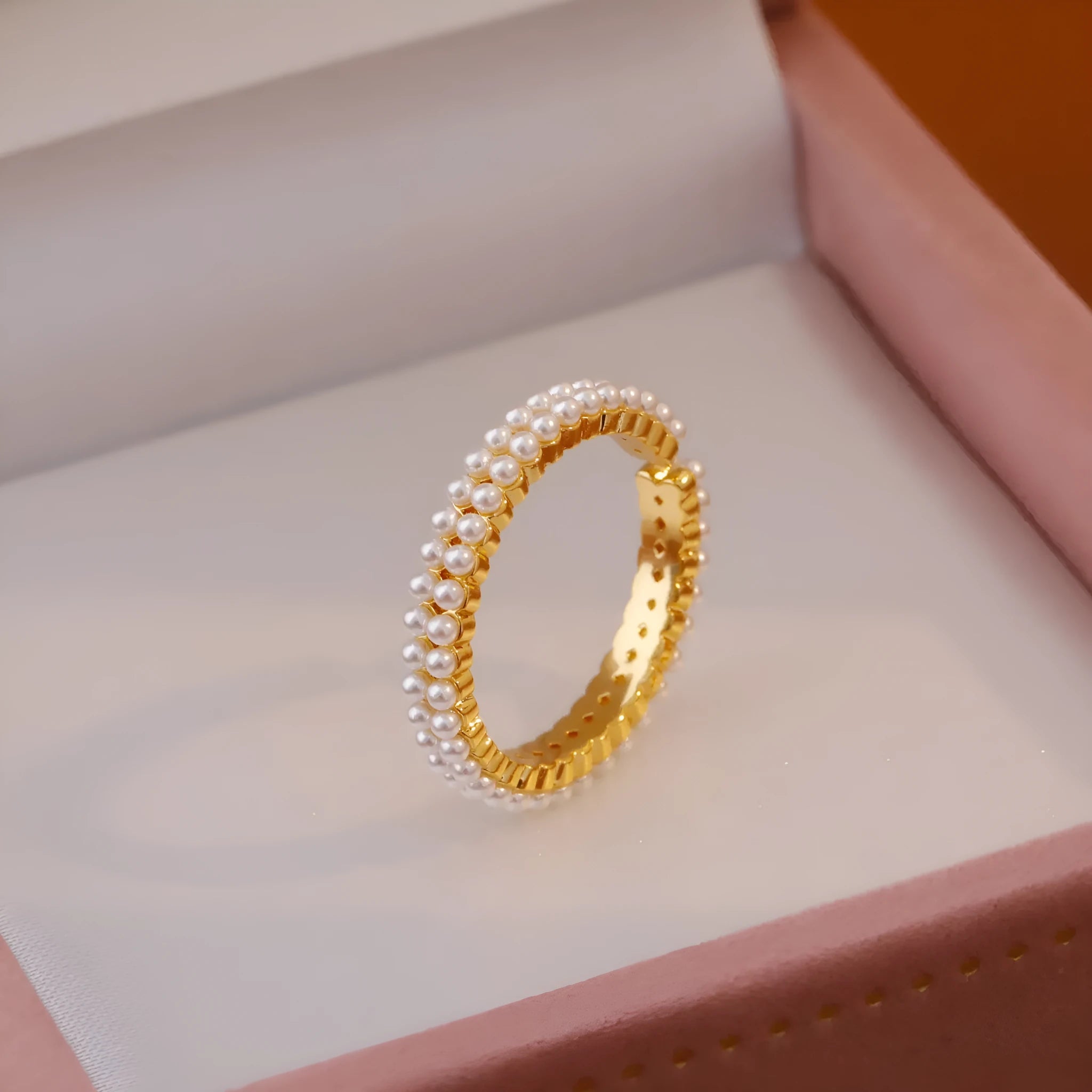 Geometric gold electroplated women's ring with open mouth design and round pearl element