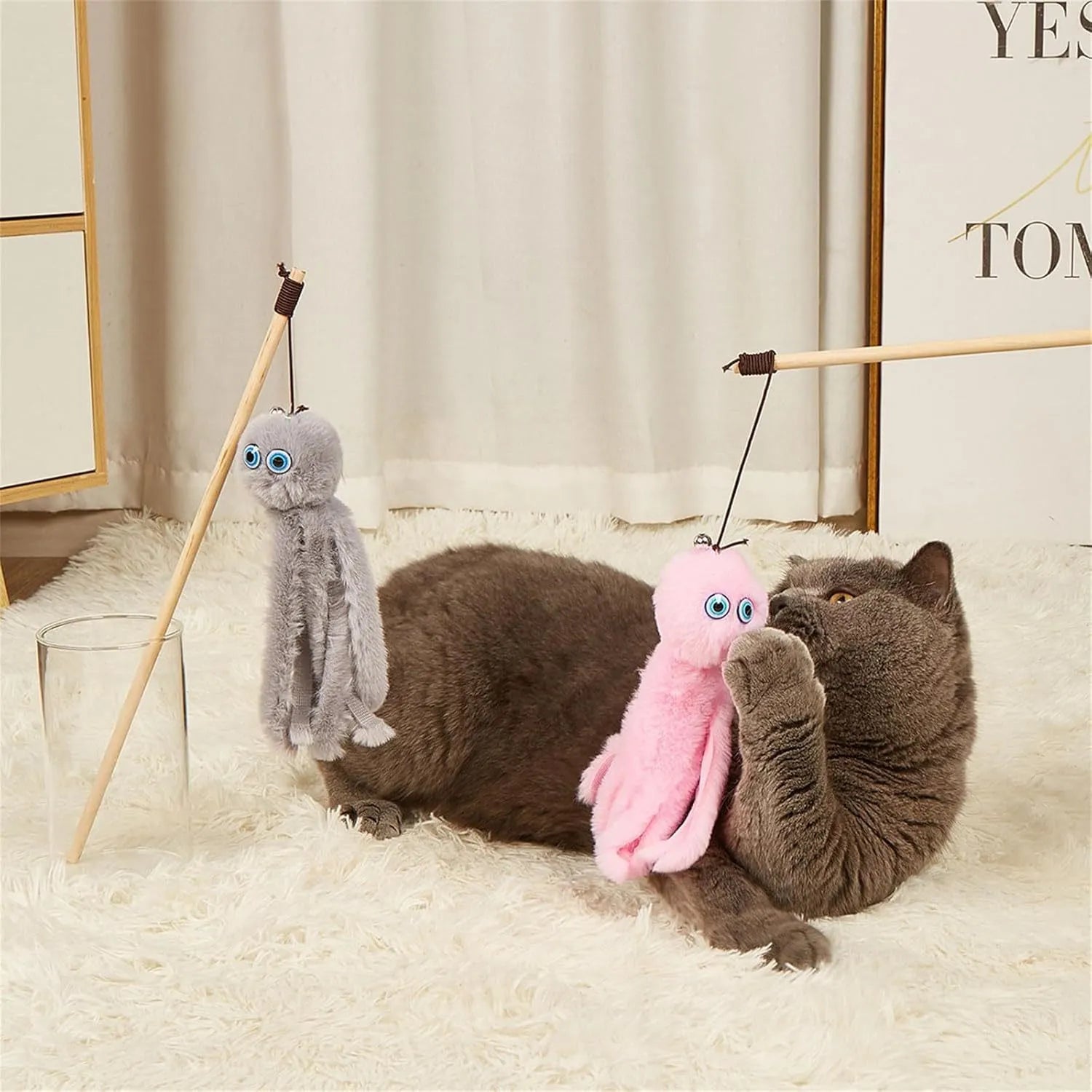 Colourful plush octopus cat toy attached to a long stick for interactive play.