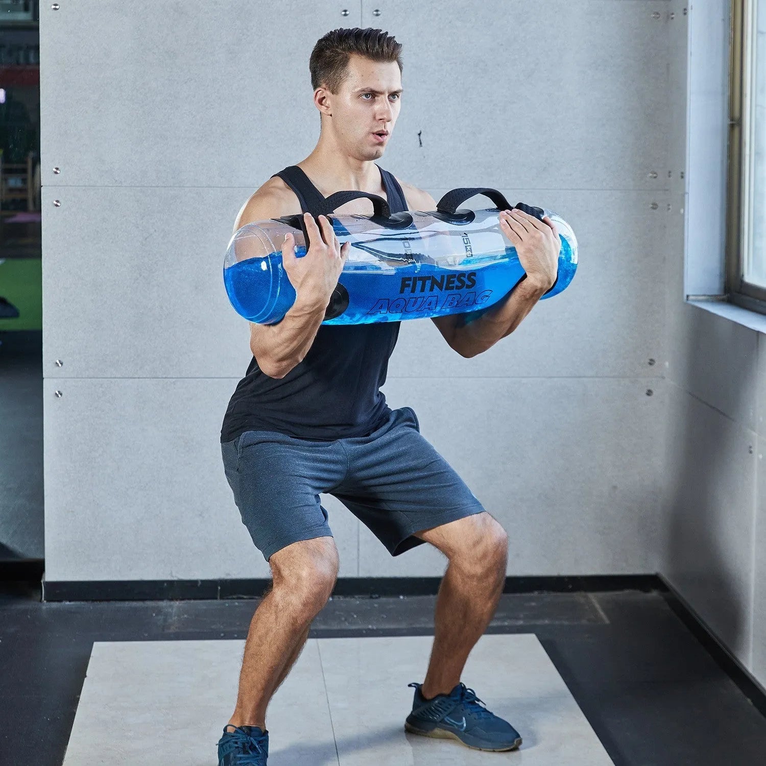 Transparent PVC inflatable water weight lifting bag in a soft dumbbell shape