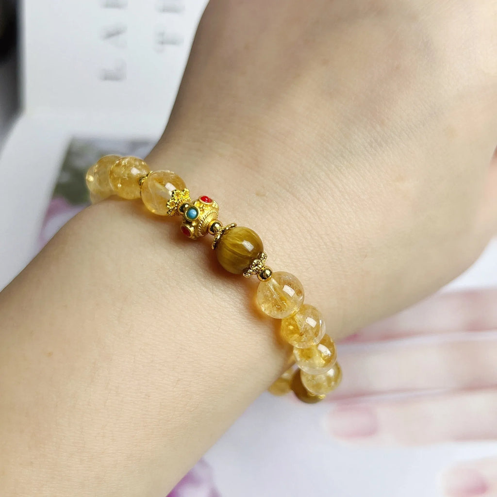 Women's citrine-coloured crystal bracelet with handcrafted flower tassel design