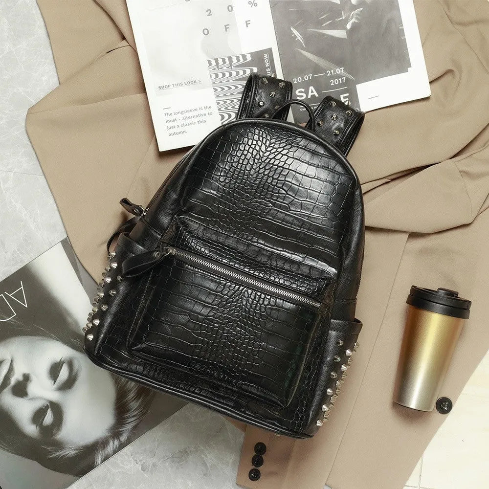 Black waterproof computer schoolbag with 55L capacity and decorative rivet details