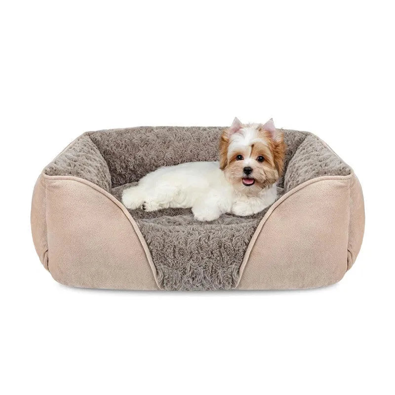 Beige bolster dog bed for large dogs with soft interior and raised sides on a wooden floor.