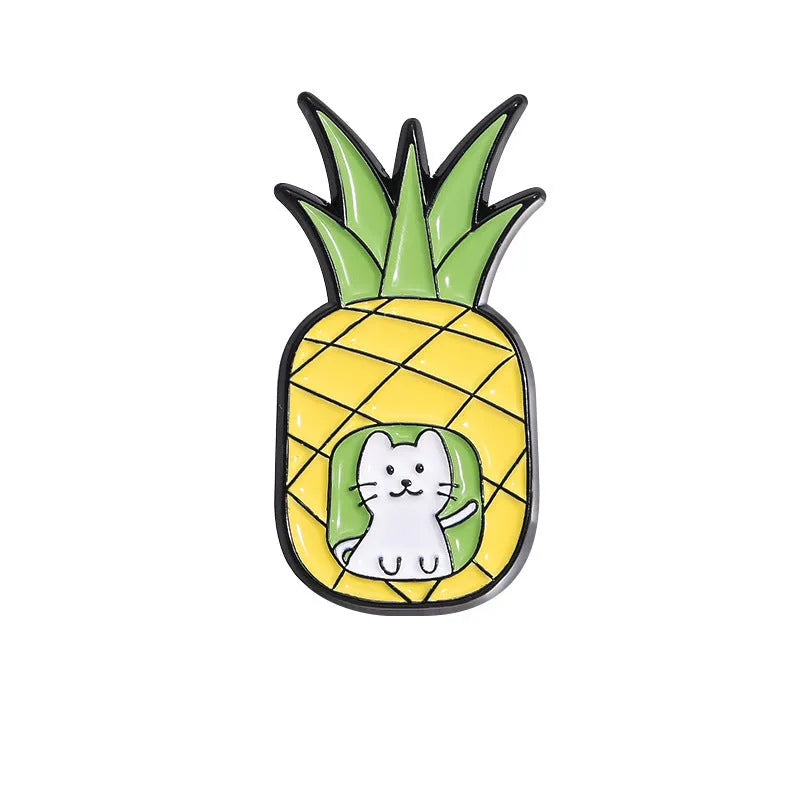 Colourful cartoon fruit and letter design on a metal brooch pin with a secure clasp.