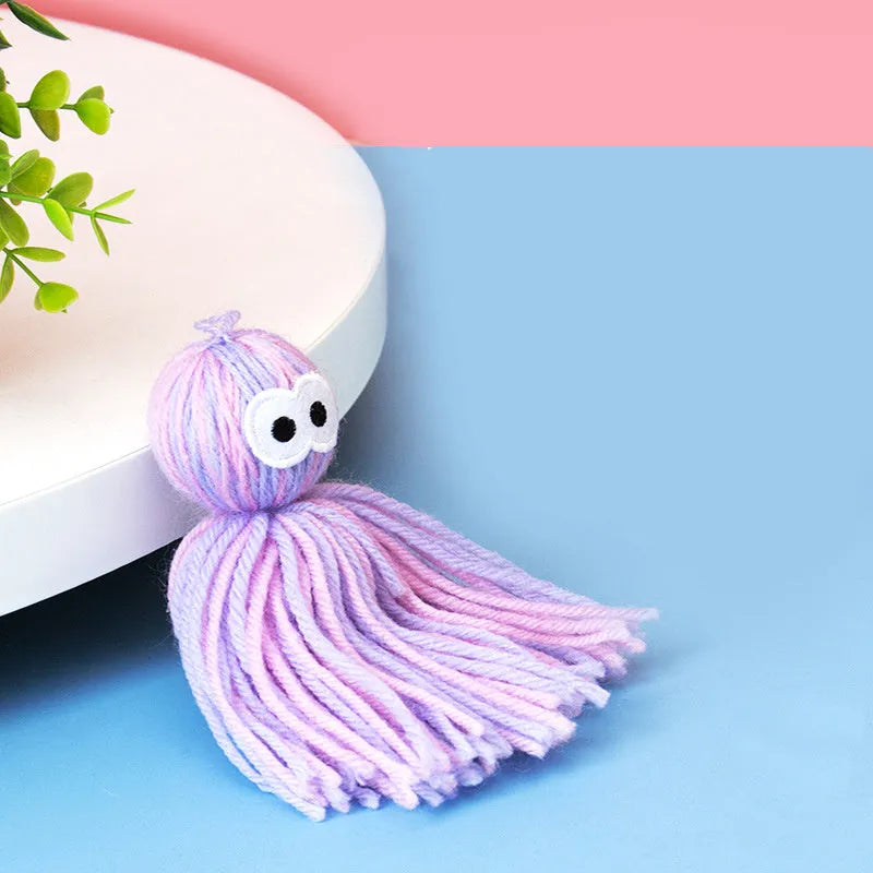 Cat toy set with wool ball, hanging attachment, and teaser stick in blue-gray colour combination