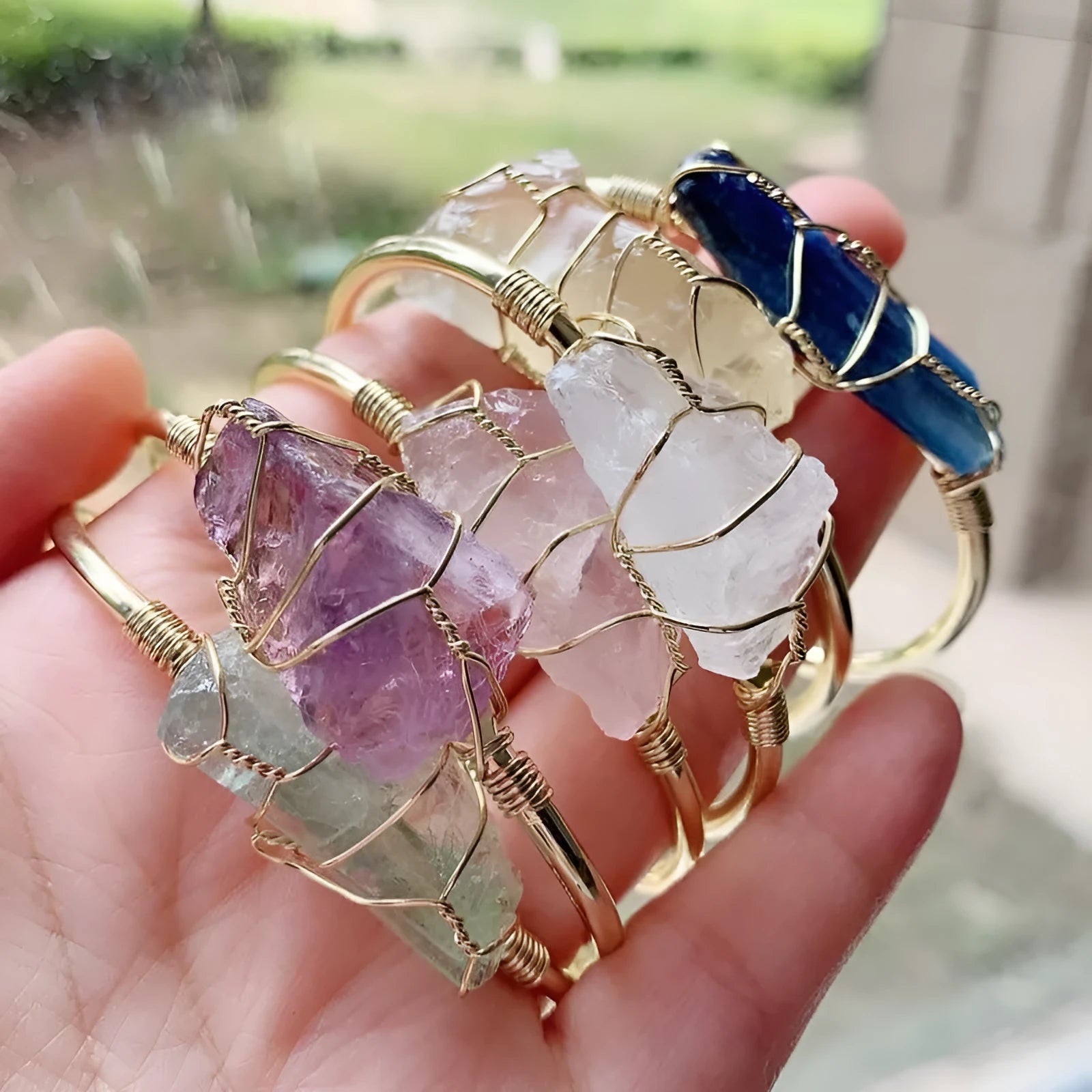 Geometric bracelet made of natural rough crystal stones wrapped with gold-coloured wire