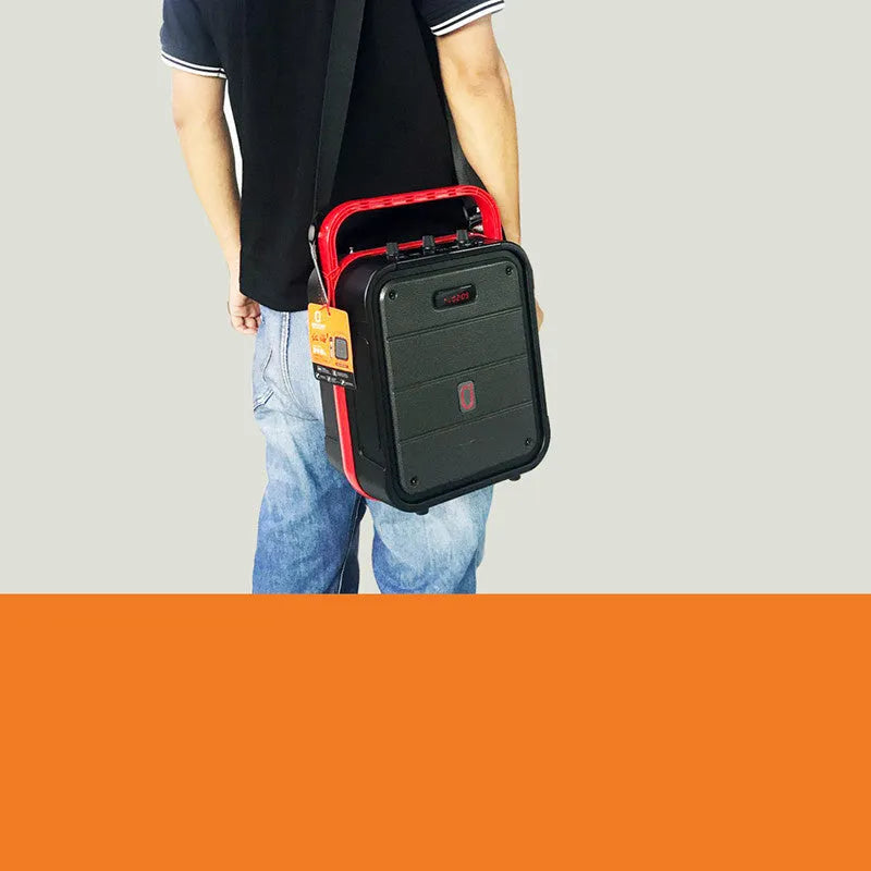 MS62AI portable Bluetooth speaker with wireless microphone, remote control, and shoulder strap