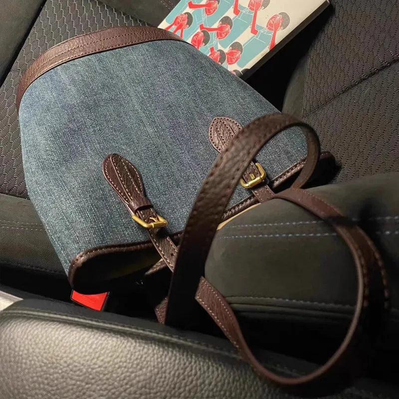 Denim patchwork bucket handbag with one shoulder strap showing retro styling