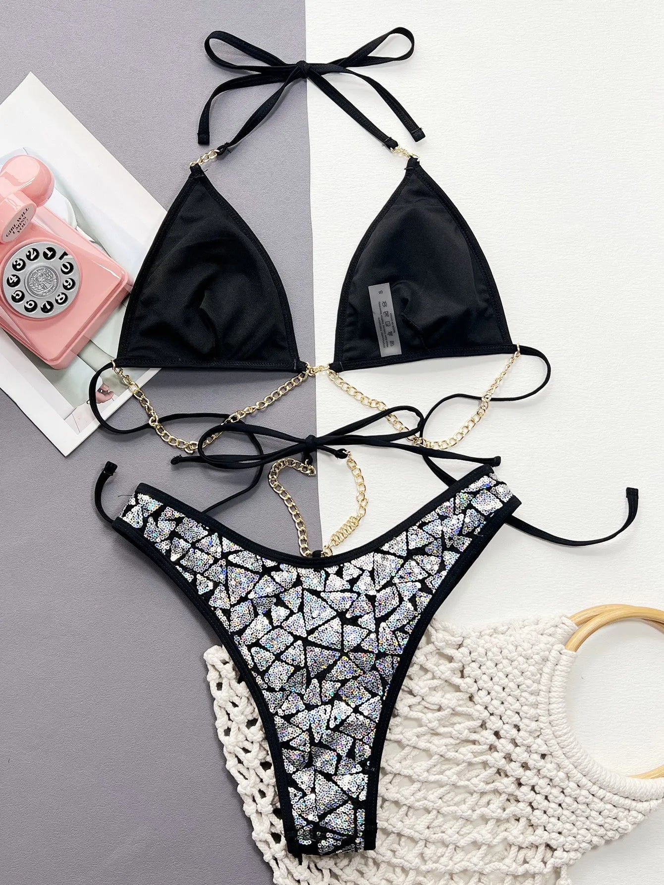 Silver black women's bikini swimsuit with flash iron chain detail, briefs style, for swimming.