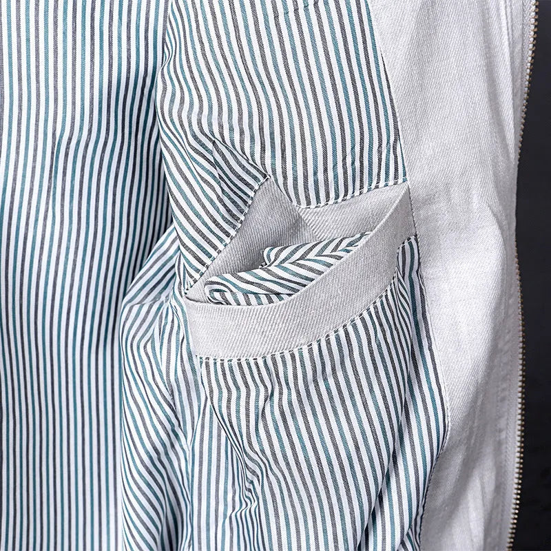 Men's thin colour block linen jacket in blue, grass green, or heather grey on a hanger.