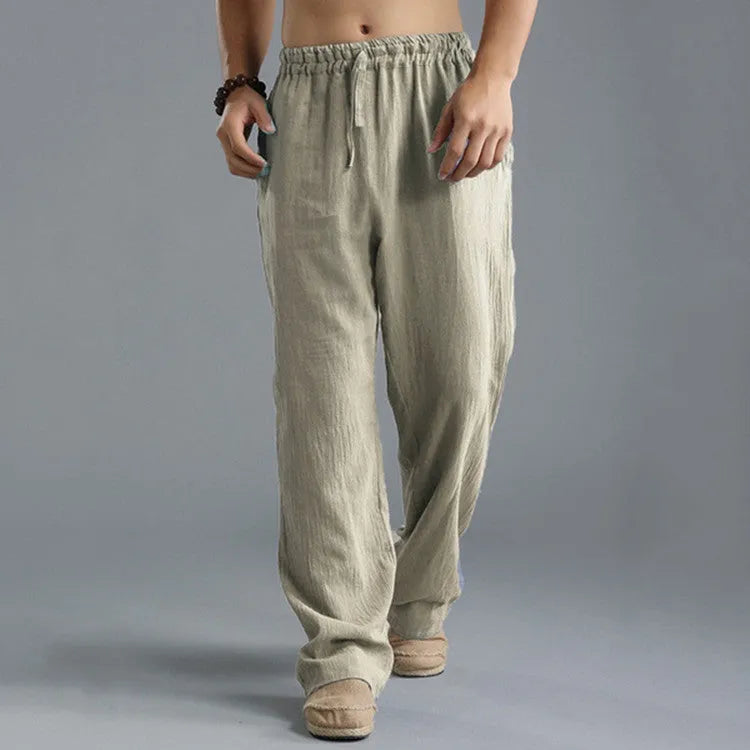 Men's linen loose casual sports pants in khaki, side view, on a hanger