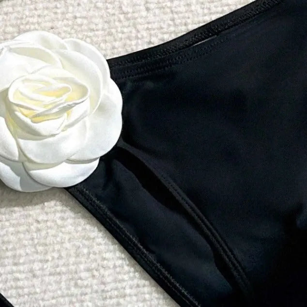 Black women's two-piece bikini with 3D floral lace detail on drawstring waistband, backless design.