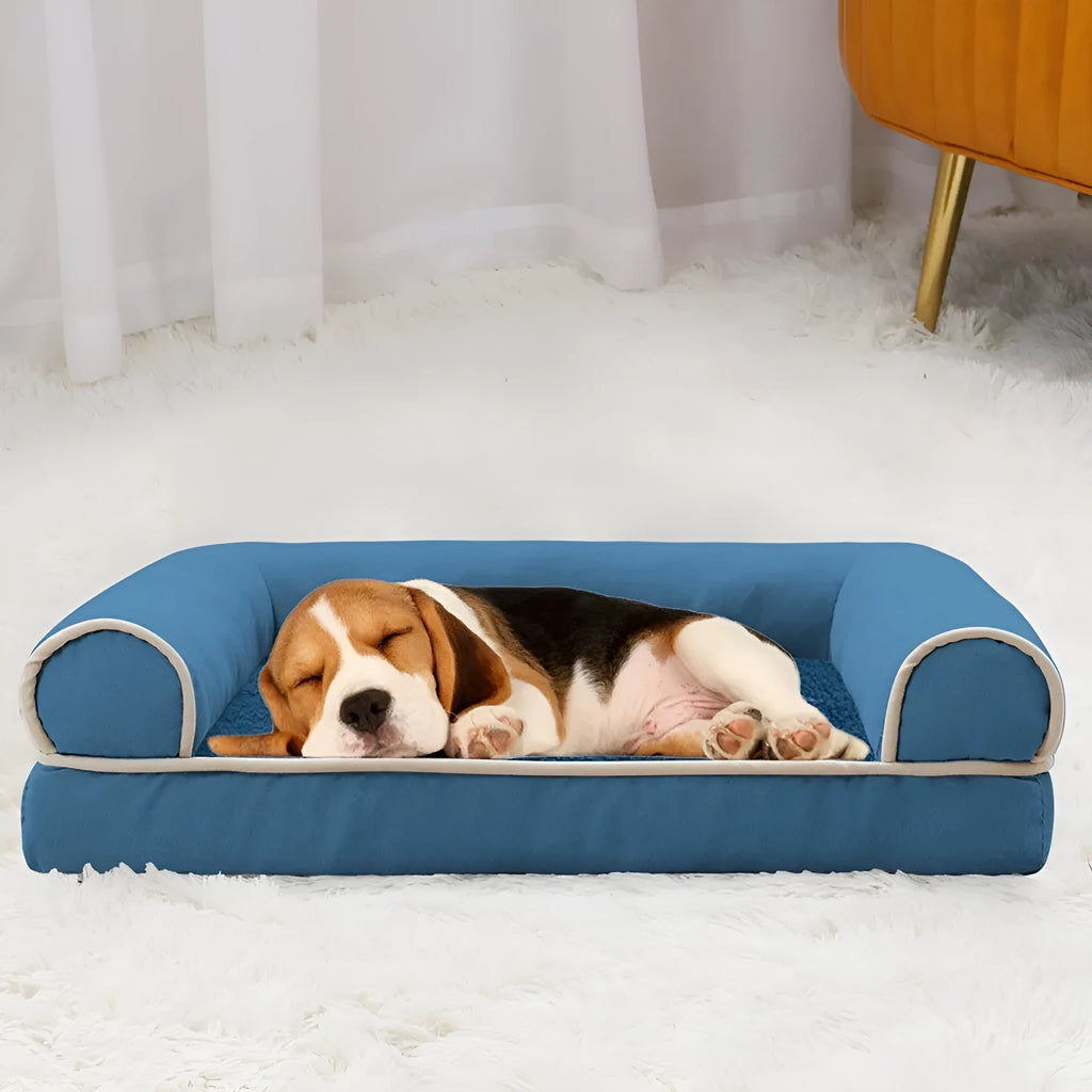 A square breathable sponge dog bed in a crate, available in blue, grey, and beige colours.