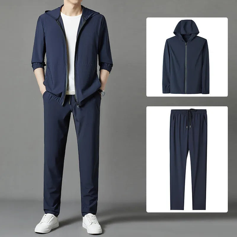 Grey hooded sun-protective top and trousers casual set laid flat showing loose fit and pocket detail