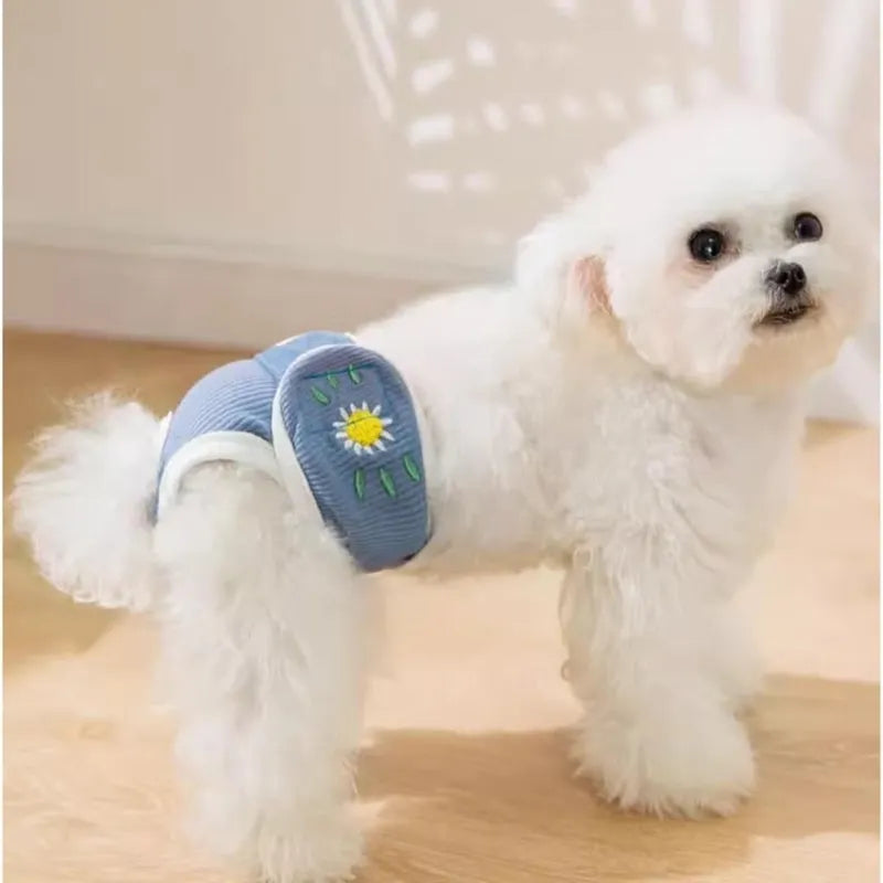 Reusable washable dog physiological pants in blue with cartoon print on a white background