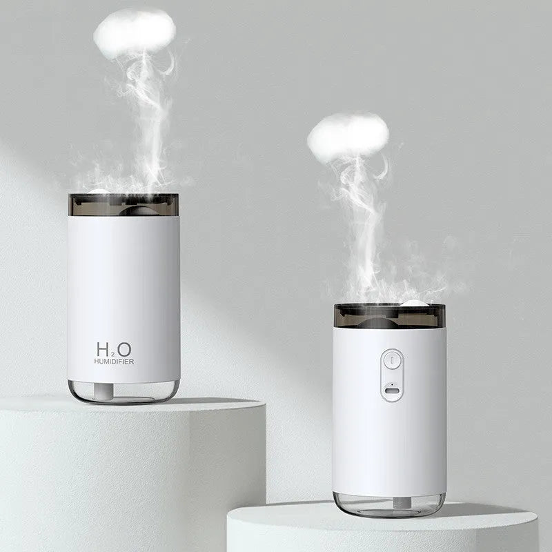 White portable USB humidifier with jellyfish mist spray and warm night light on wooden surface