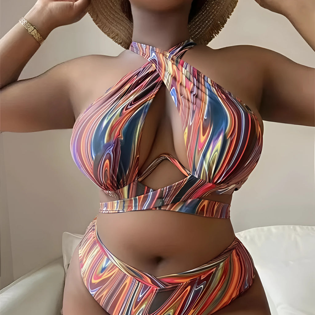 Women's floral high-waist bikini swimsuit top and pants in plus sizes.